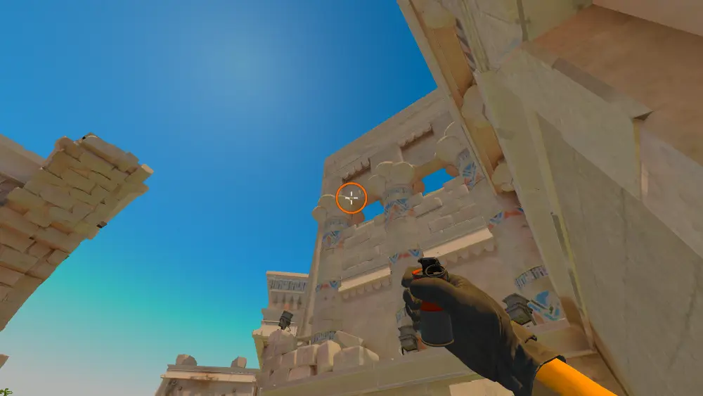 Standing on the Ruins spot on Anubis, the aim mark on the point this smoke is thrown at.