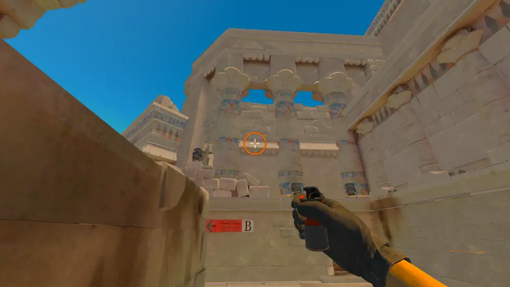 Standing on the Ruins spot on Anubis, the aim mark on the point this smoke is thrown at.