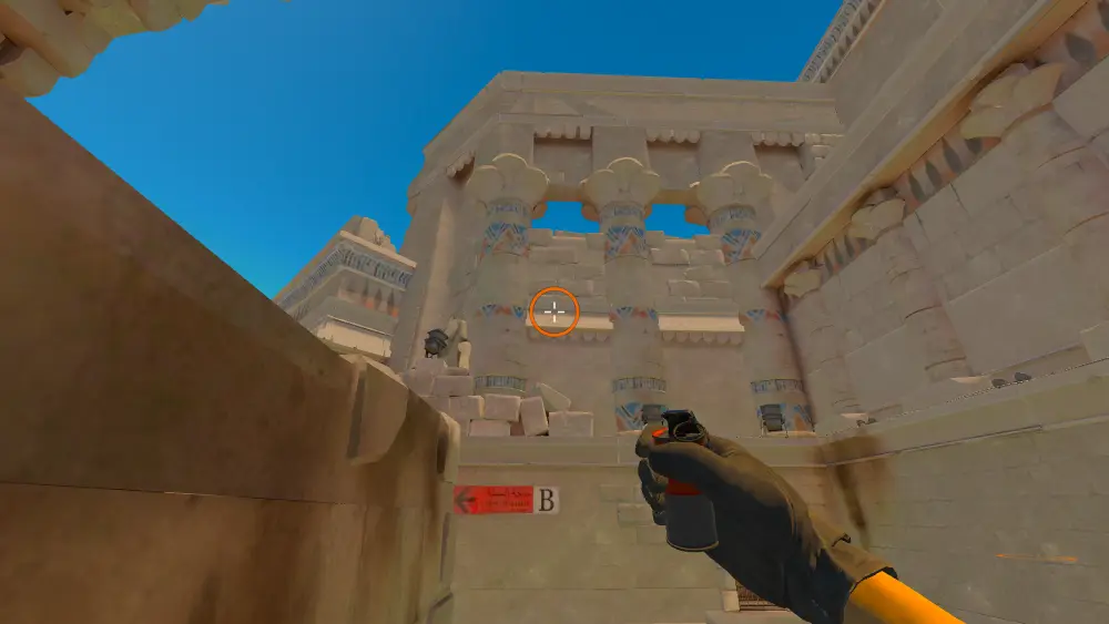 Standing on the Ruins spot on Anubis, the aim mark on the point this smoke is thrown at.