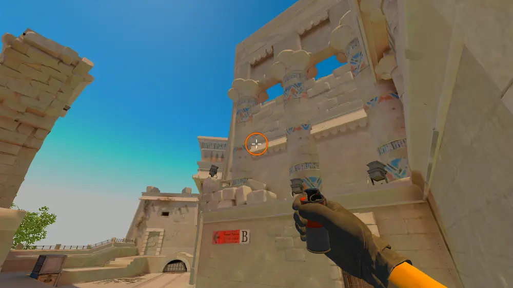 Standing on the Ruins spot on Anubis, the aim mark on the point this smoke is thrown at.
