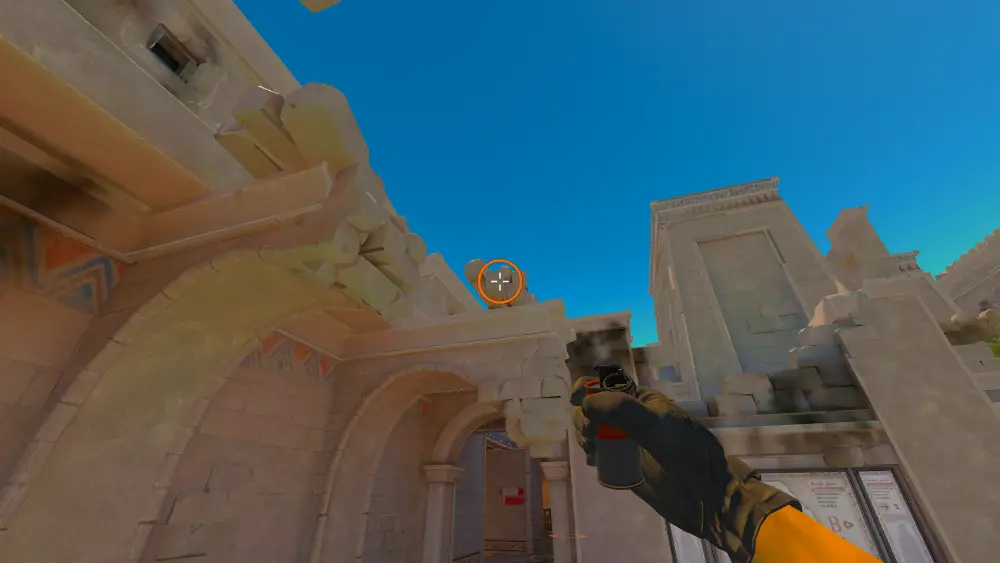 Standing on the CT Spawn spot on Anubis, the aim mark on the point this smoke is thrown at.
