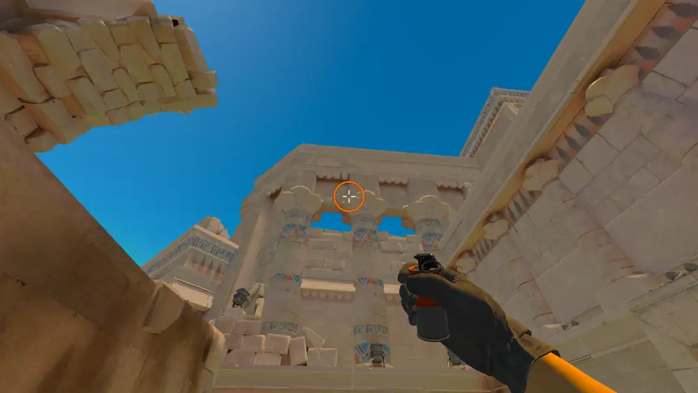Standing on the Ruins spot on Anubis, the aim mark on the point this smoke is thrown at.