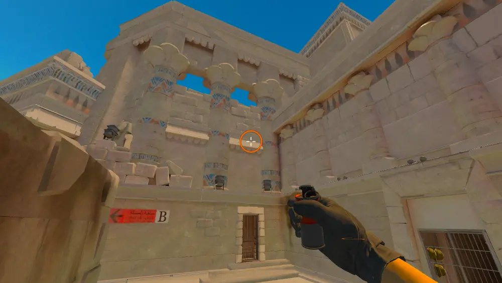 Standing on the Ruins spot on Anubis, the aim mark on the point this smoke is thrown at.