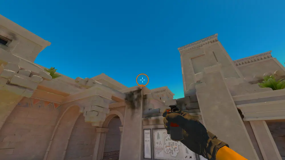 Standing on the CT Spawn spot on Anubis, the aim mark on the point this smoke is thrown at.