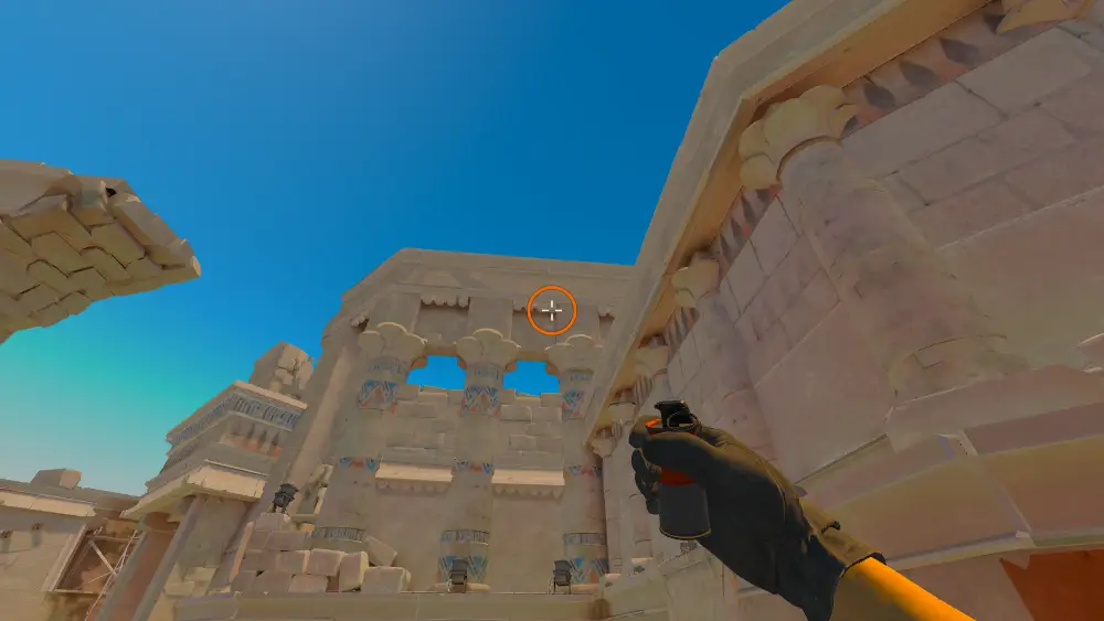 Standing on the Ruins spot on Anubis, the aim mark on the point this smoke is thrown at.