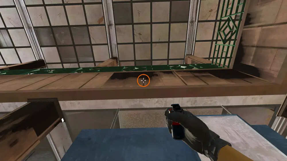 Standing on the CT Spawn spot on Cache, the aim mark on the point this smoke is thrown at.