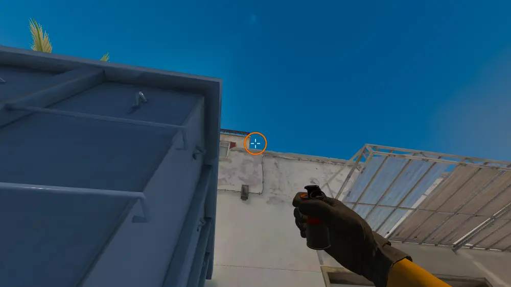 Standing on the Dumpster spot on Dust2, the aim mark on the point this smoke is thrown at.