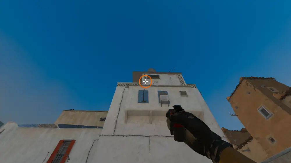 Standing on the Boost spot on Dust2, the aim mark on the point this smoke is thrown at.