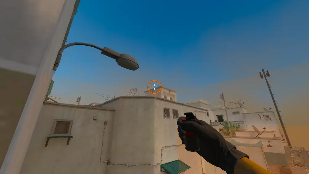 Standing on the T Spawn1 spot on Dust2, the aim mark on the point this smoke is thrown at.