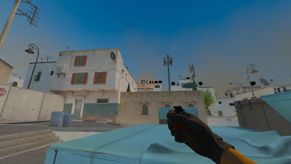 Standing on the Dust2 spot on Dust2, the aim mark on the point this smoke is thrown at.