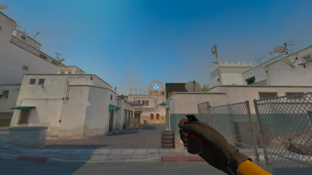 Standing on the T Spawn1 spot on Dust2, the aim mark on the point this smoke is thrown at.