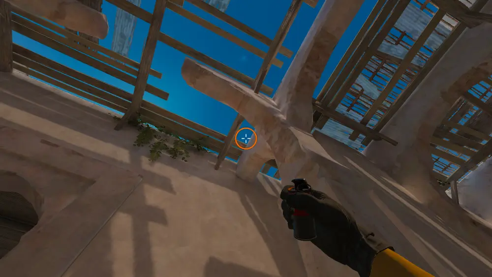 Standing on the Upper Tunnels spot on Dust2, the aim mark on the point this smoke is thrown at.