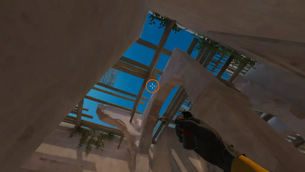 Standing on the Upper Tunnels spot on Dust2, the aim mark on the point this smoke is thrown at.