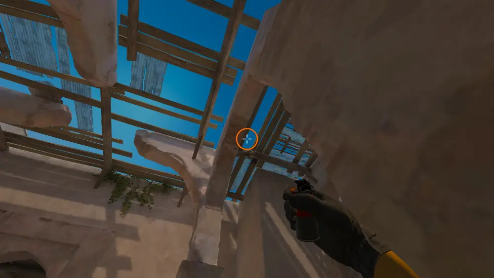Standing on the Upper Tunnels spot on Dust2, the aim mark on the point this smoke is thrown at.