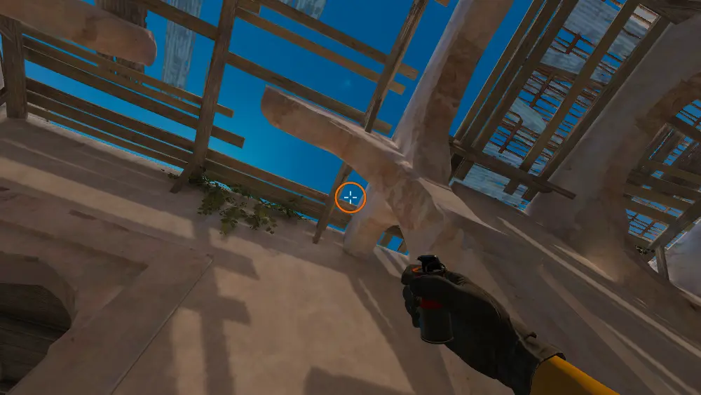 Standing on the Upper Tunnels spot on Dust2, the aim mark on the point this smoke is thrown at.