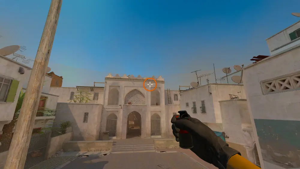 Standing on the T Plat spot on Dust2, the aim mark on the point this smoke is thrown at.