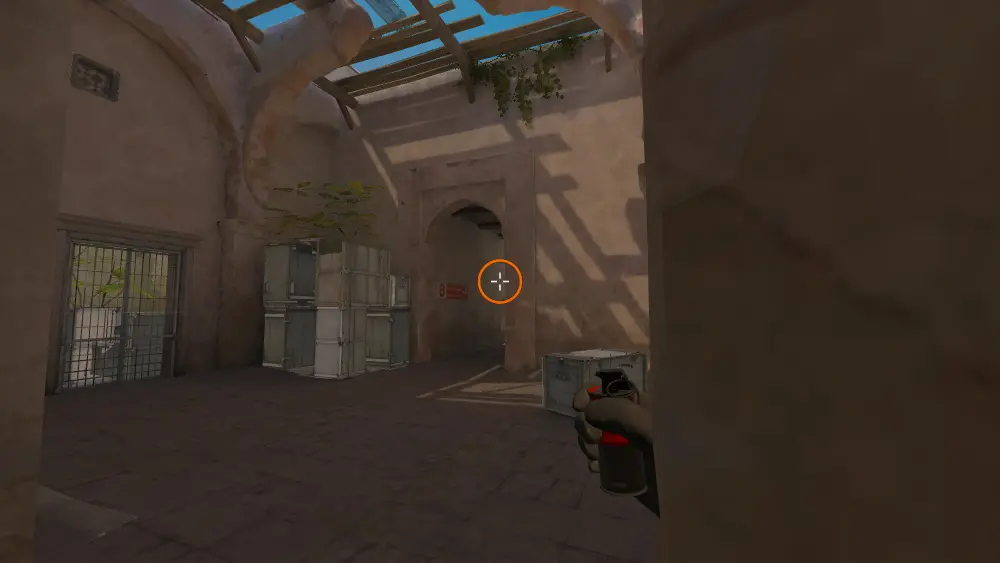 Standing on the Upper Tunnels spot on Dust2, the aim mark on the point this smoke is thrown at.