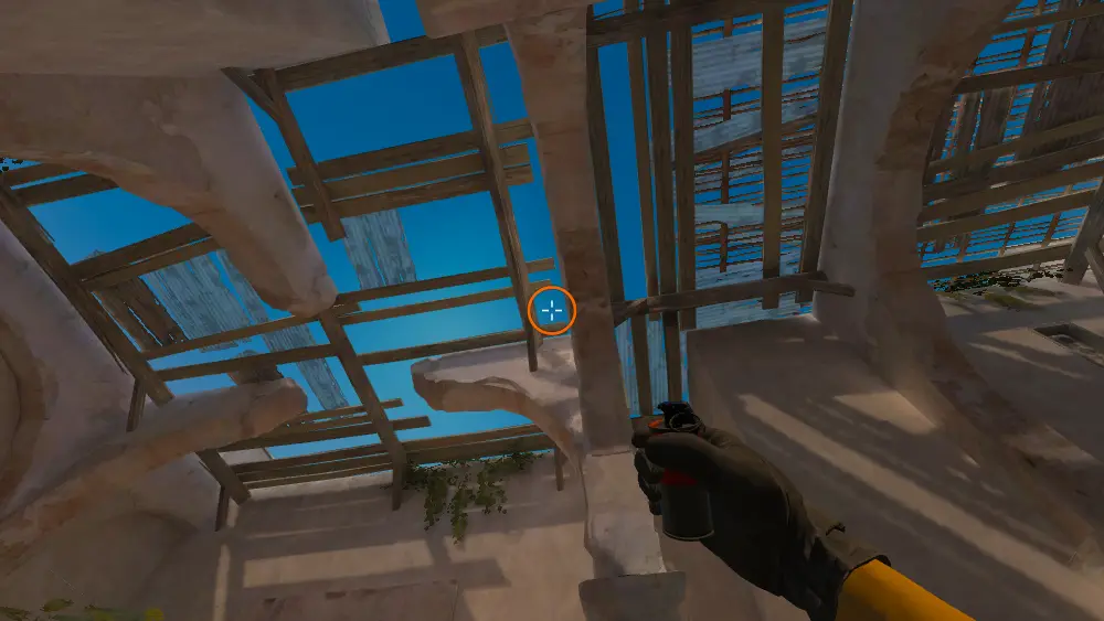 Standing on the Upper Tunnels spot on Dust2, the aim mark on the point this smoke is thrown at.