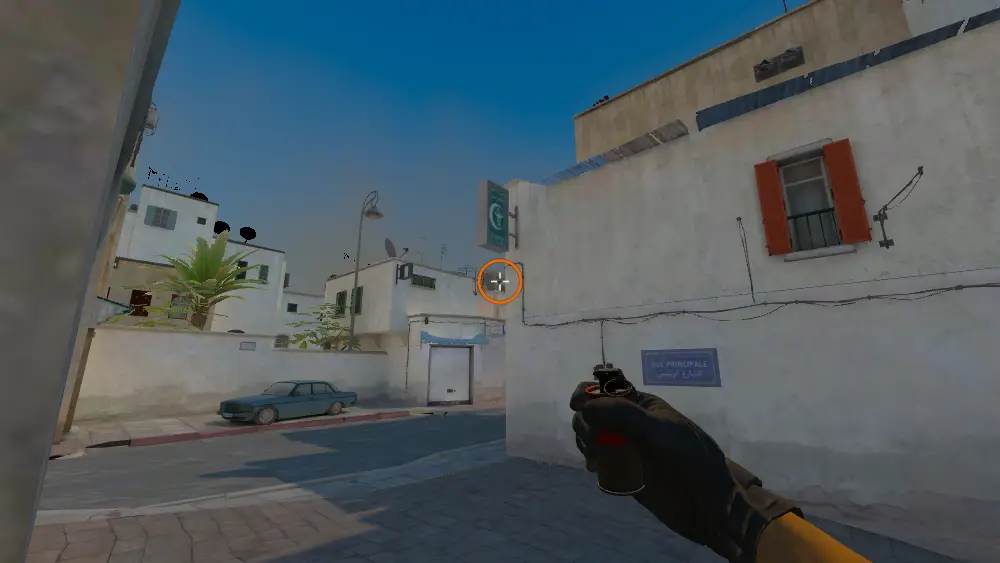 Standing on the Dust2 spot on Dust2, the aim mark on the point this smoke is thrown at.