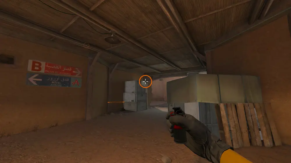 Standing on the CT Spawn spot on Dust2, the aim mark on the point this smoke is thrown at.
