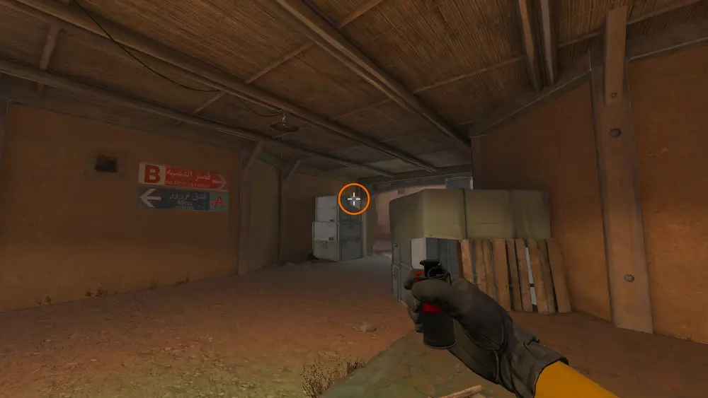 Standing on the CT Spawn spot on Dust2, the aim mark on the point this smoke is thrown at.