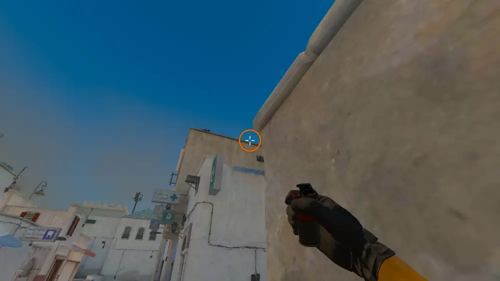 Standing on the A Ramp spot on Dust2, the aim mark on the point this smoke is thrown at.