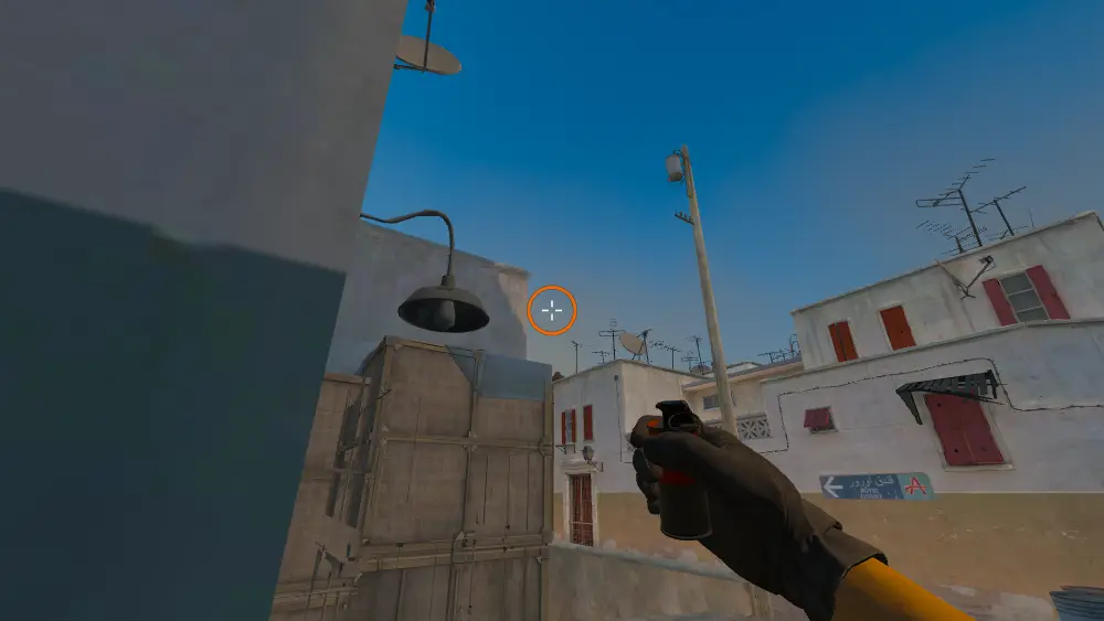 Standing on the Top Mid spot on Dust2, the aim mark on the point this smoke is thrown at.