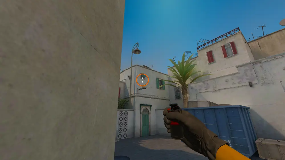 Standing on the A Site Pit spot on Dust2, the aim mark on the point this smoke is thrown at.