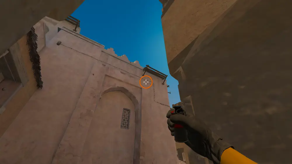 Standing on the Dust2 spot on Dust2, the aim mark on the point this smoke is thrown at.