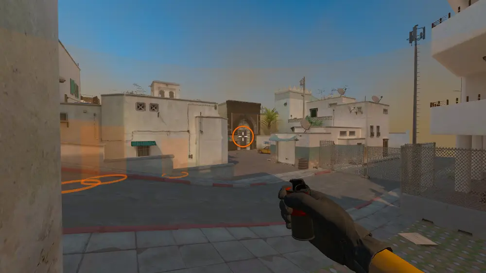 Standing on the T Spawn spot on Dust2, the aim mark on the point this smoke is thrown at.
