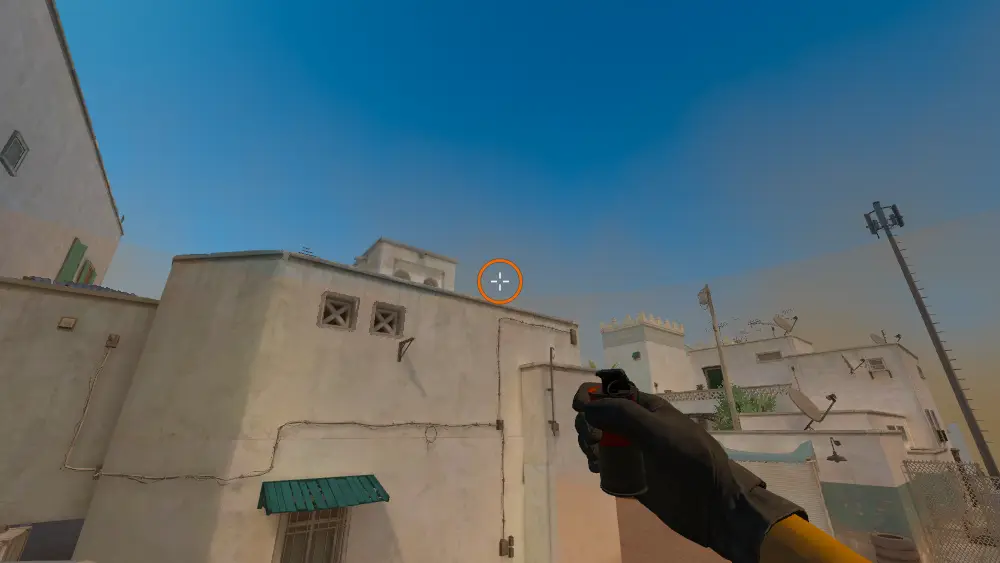 Standing on the T Spawn1 spot on Dust2, the aim mark on the point this smoke is thrown at.
