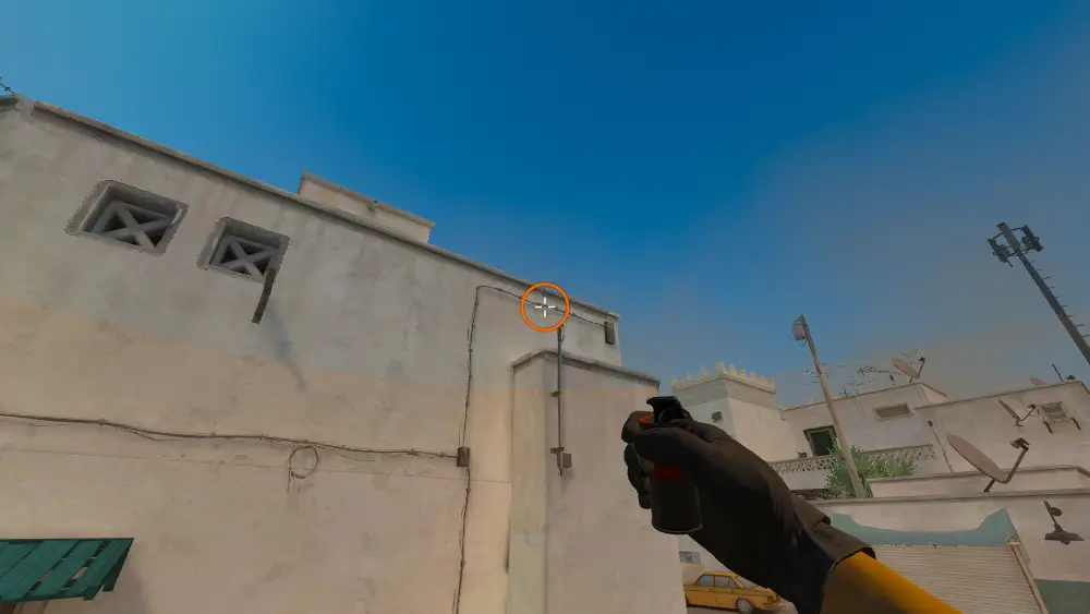 Standing on the Dust2 spot on Dust2, the aim mark on the point this smoke is thrown at.
