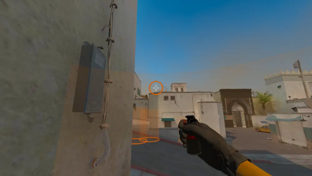 Standing on the T Spawn spot on Dust2, the aim mark on the point this smoke is thrown at.