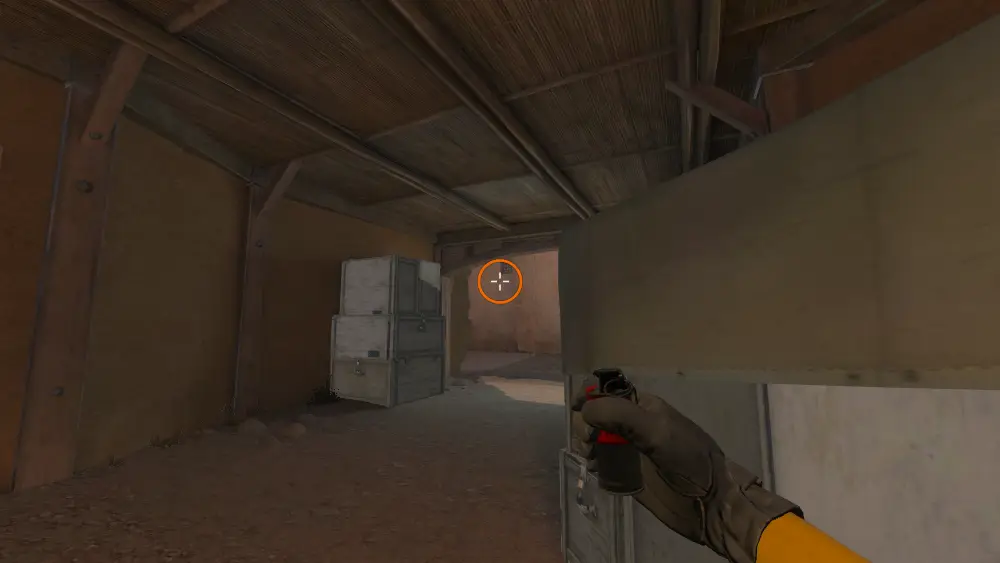 Standing on the CT Spawn spot on Dust2, the aim mark on the point this smoke is thrown at.