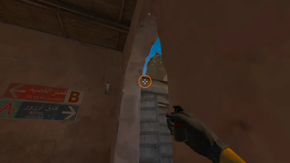 Standing on the Lower Tunnels spot on Dust2, the aim mark on the point this smoke is thrown at.