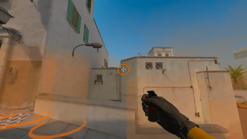 Standing on the Dust2 spot on Dust2, the aim mark on the point this smoke is thrown at.