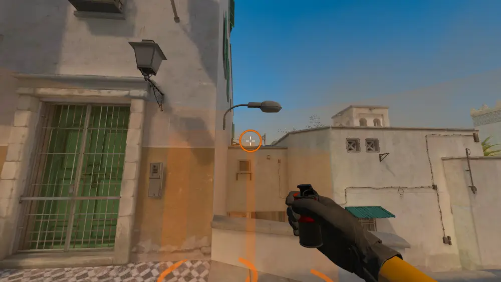 Standing on the Dust2 spot on Dust2, the aim mark on the point this smoke is thrown at.
