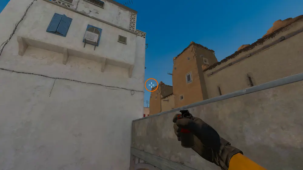 Standing on the Dust2 spot on Dust2, the aim mark on the point this smoke is thrown at.