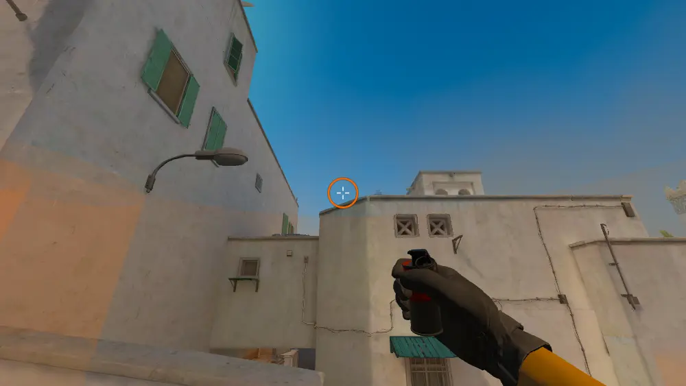 Standing on the Dust2 spot on Dust2, the aim mark on the point this smoke is thrown at.