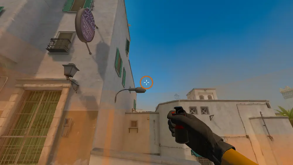 Standing on the Dust2 spot on Dust2, the aim mark on the point this smoke is thrown at.