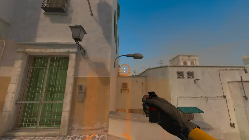 Standing on the Dust2 spot on Dust2, the aim mark on the point this smoke is thrown at.