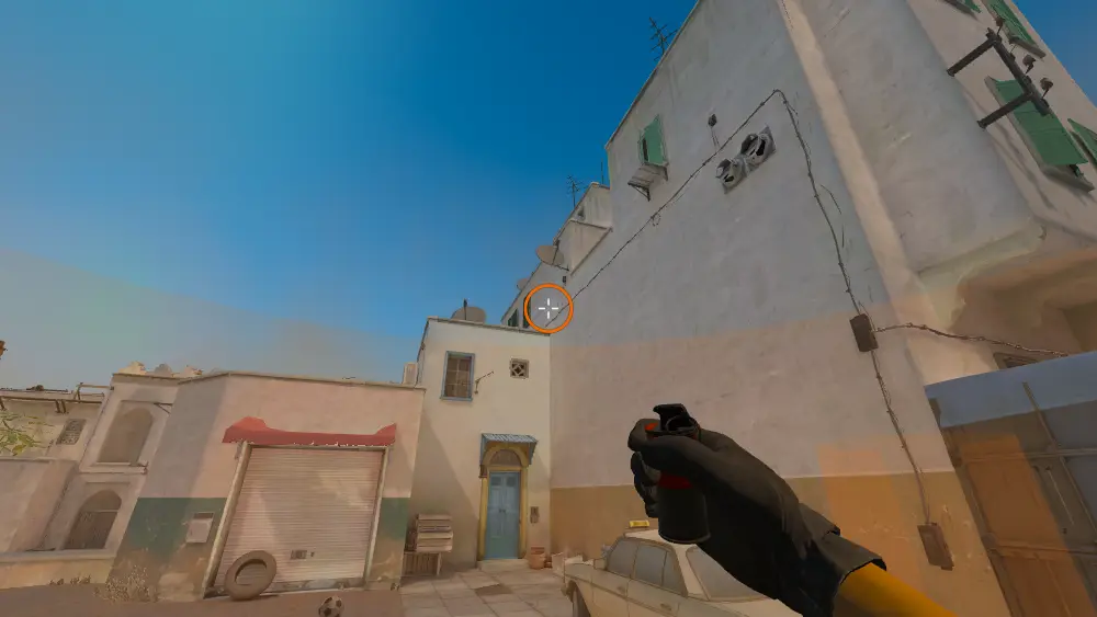 Standing on the Dust2 spot on Dust2, the aim mark on the point this smoke is thrown at.