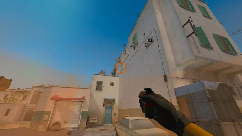 Standing on the Dust2 spot on Dust2, the aim mark on the point this smoke is thrown at.