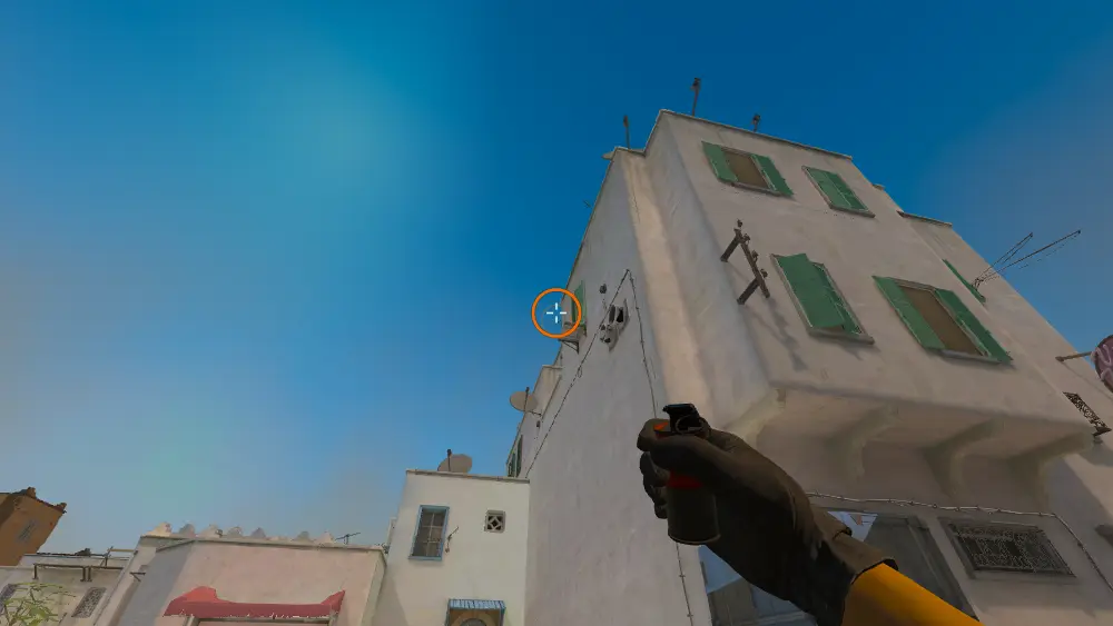Standing on the Dust2 spot on Dust2, the aim mark on the point this smoke is thrown at.