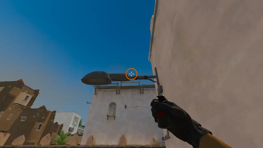Standing on the Dust2 spot on Dust2, the aim mark on the point this smoke is thrown at.