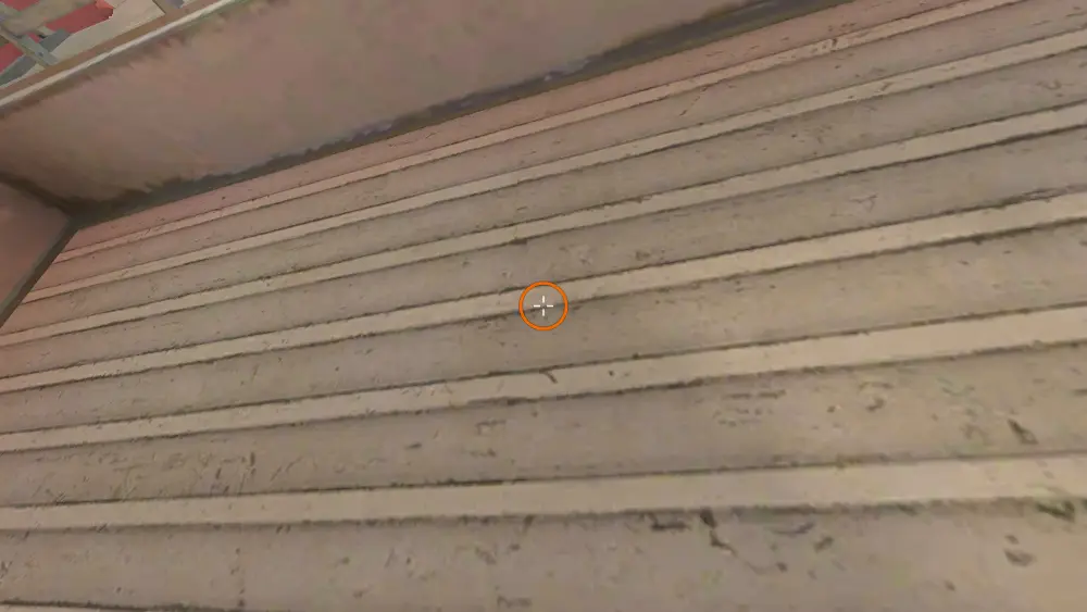 Standing on the T Spawn spot on Dust2, the aim mark on the point this smoke is thrown at.