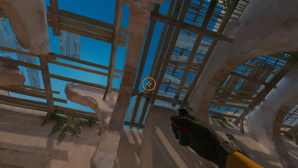 Standing on the Upper Tunnels spot on Dust2, the aim mark on the point this smoke is thrown at.