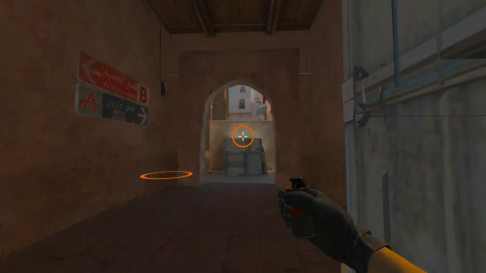 Standing on the Lower Tunnels spot on Dust2, the aim mark on the point this smoke is thrown at.
