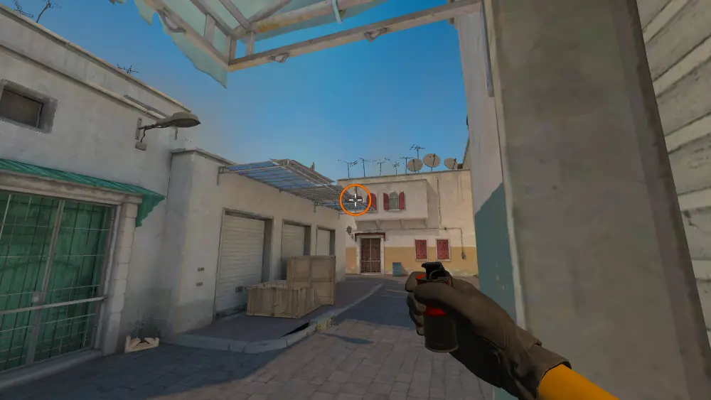 Standing on the Outside T Spawn spot on Dust2, the aim mark on the point this smoke is thrown at.