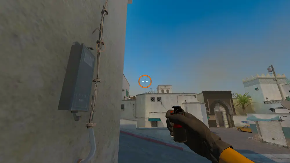 Standing on the T Spawn Corner spot on Dust2, the aim mark on the point this smoke is thrown at.